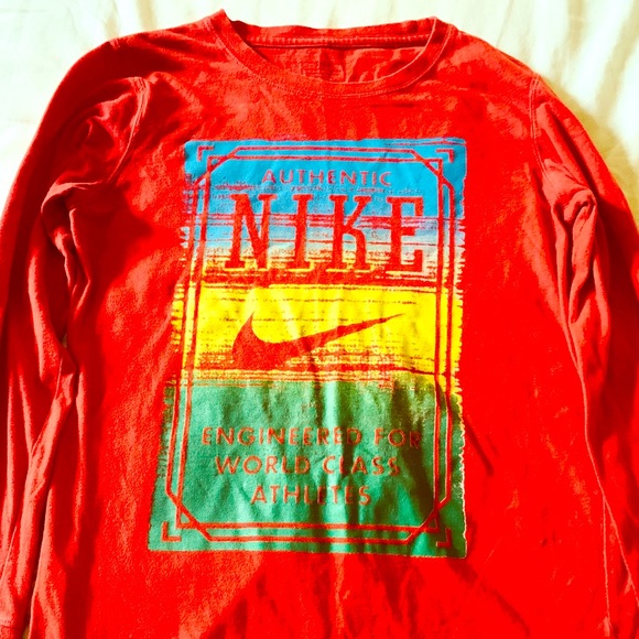 yellow and red nike shirt